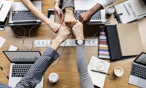 Colleagues giving a fist bump